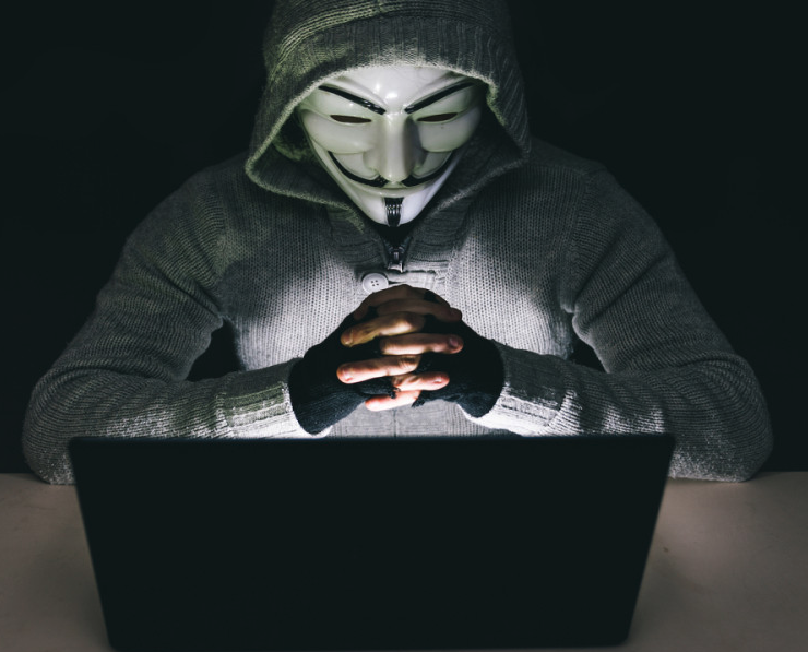 A 2021 Facebook profile picture, showing a background image of the Guy Fawkes/Anonymous mask. 