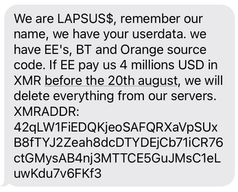 A screenshot of a text message from early activity of the Lapsus$ Group. The message threatens to delete user data and brags about the threat actor's possession of source code. 