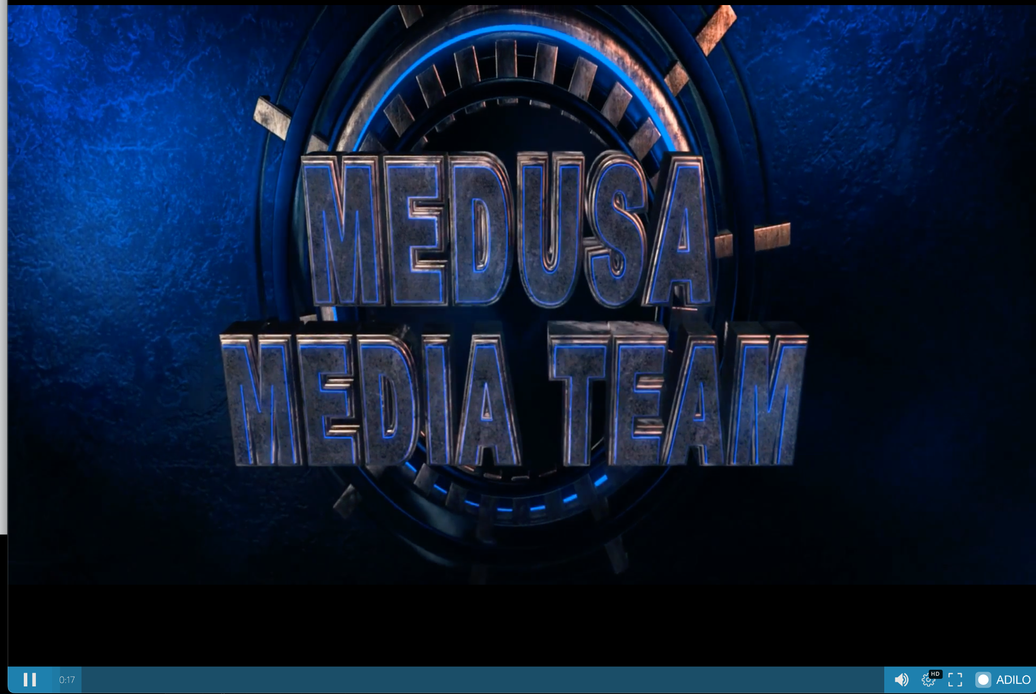 Image 3 is a screenshot of a Medusa Media Team video. Capital text against what looks to be a ship’s wheel. 