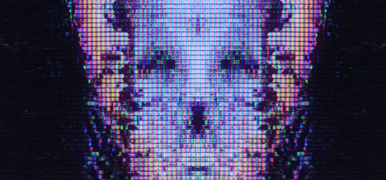Close-up view of a digital screen displaying a distorted and pixelated image of a skull-like visage with a strong emphasis on blue and purple tones.
