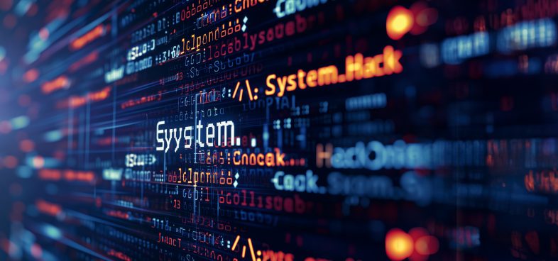 A vivid, close-up image of a digital screen displaying lines of programming code in white text with the word "System" prominently highlighted in the center as well as "System Hack." The background consists of blurred blue and red digital binary code, creating a sense of depth and focusing on the highlighted text.