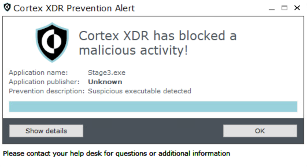 Alert window from Cortex XDR stating that a malicious activity was blocked. The application involved is named "Stage3.exe" with an unknown publisher, described as a suspicious executable. Buttons for "Show details" and "OK" are visible, with a message advising to contact the help desk for further information.