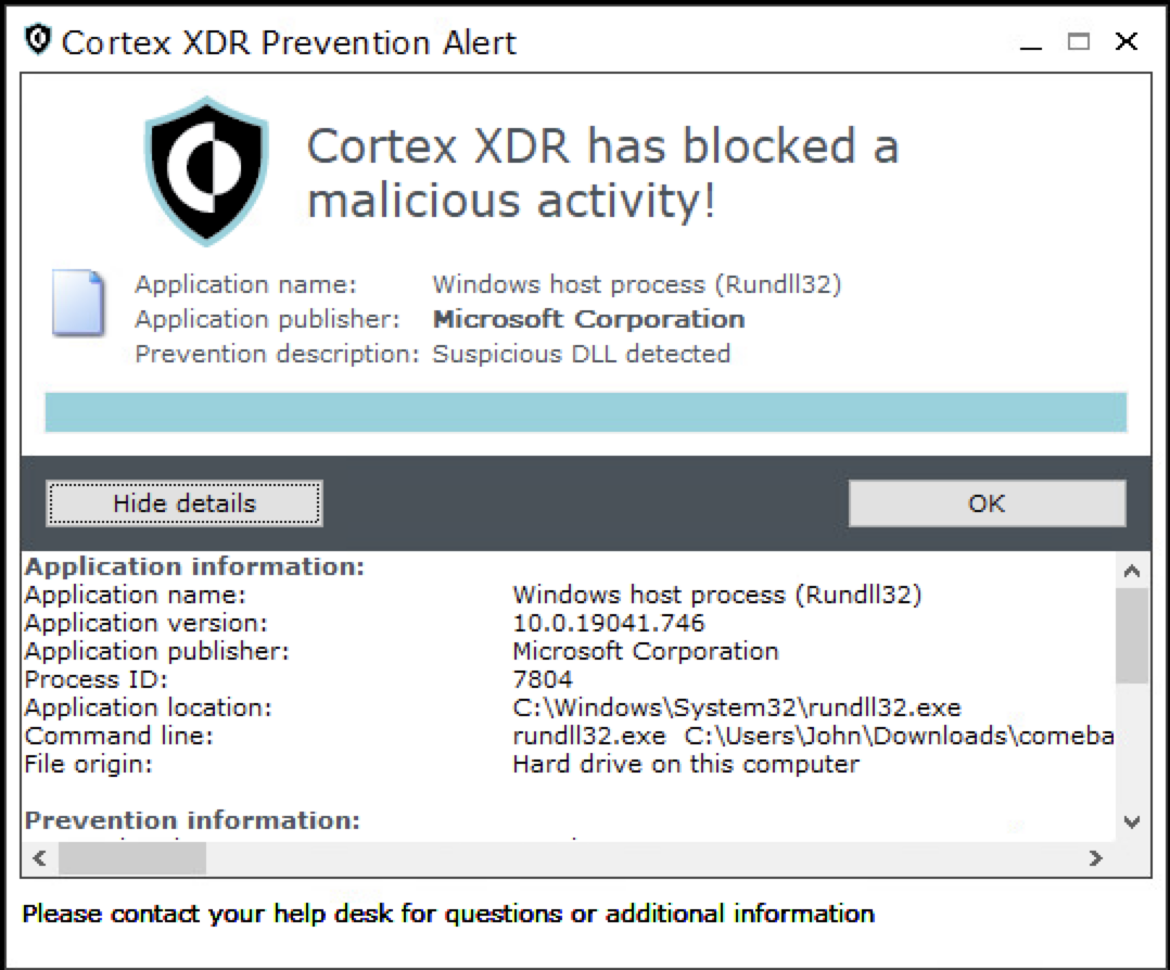 Alert window titled 'Cortex XDR Prevention Alert' stating that a malicious activity has been blocked. The alert is linked to an application called 'RunDll32' from Microsoft Corporation. Buttons for 'Hide details' and 'OK' are present, and the window includes additional details about the application and prevention description.