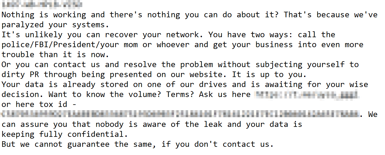The image displays a text of a ransomware threat message stating that the sender has paralyzed the recipient's systems and offers two options: contacting authorities or resolving the problem privately. The message implies possession of the recipient's data and confidentiality unless contact is not established. Some of the information is redacted.
