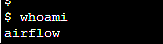 A computer screen displaying a command prompt where the command "whoami" has been typed and the response underneath is "airflow". The text is in white with a black background.