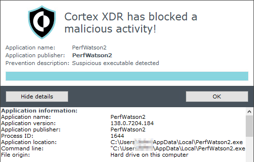 A screenshot of Cortex XDR security alert. It indicates that a malicious activity has been blocked. The application name is identified as a suspicious executable. The alert provides application details, including publisher information and file origin on the user's hard drive. There are two buttons labeled "Hide details" and "OK".